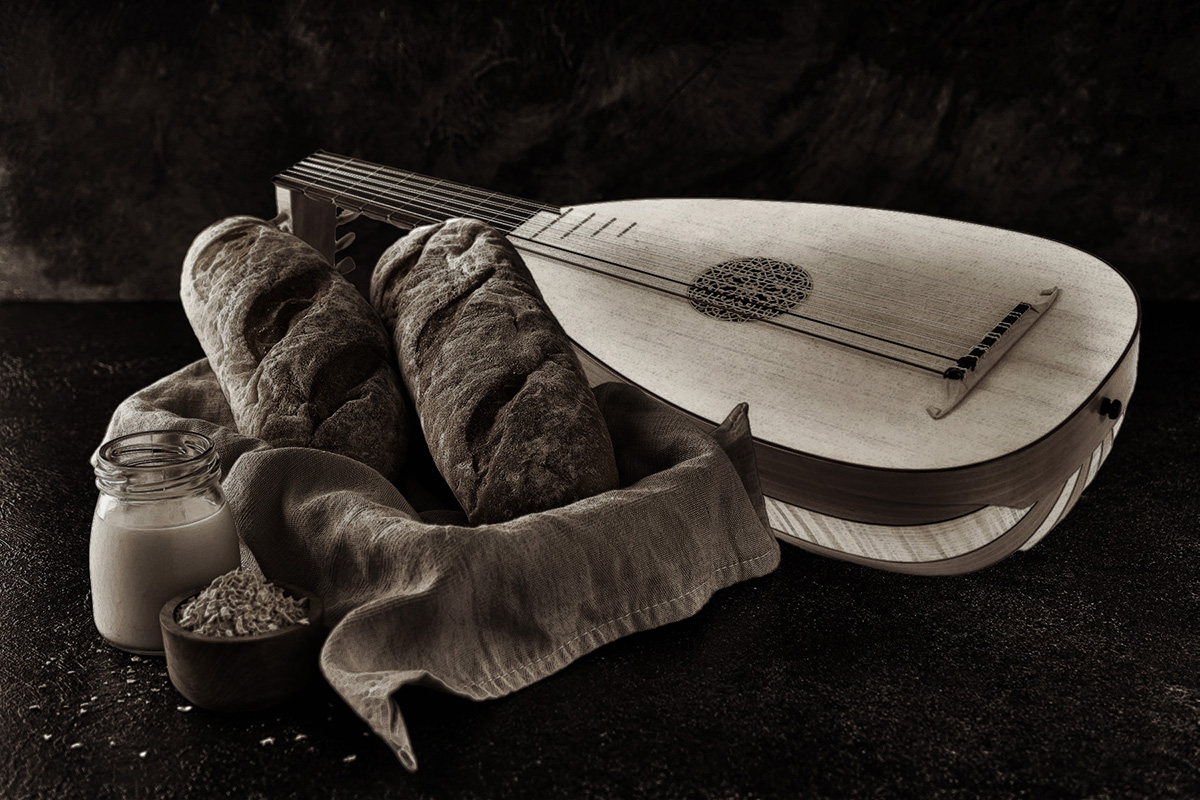 Loaves of Bread , a Lute, and a Cup on a Table
